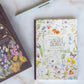 the way of the wildflower guided journal Floral notebook and pen on a marble surface