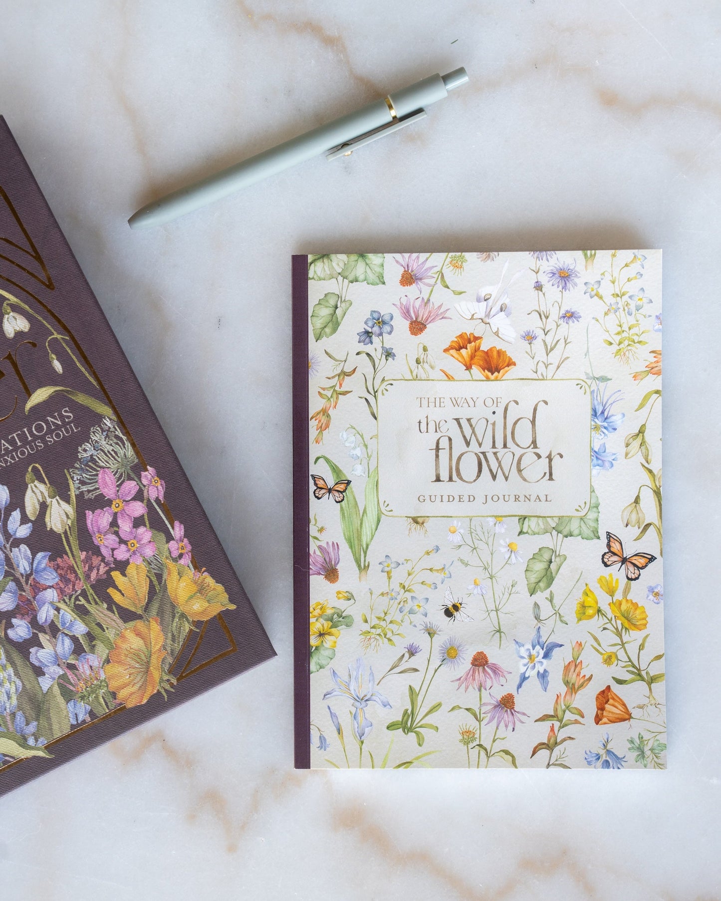 the way of the wildflower guided journal Floral notebook and pen on a marble surface